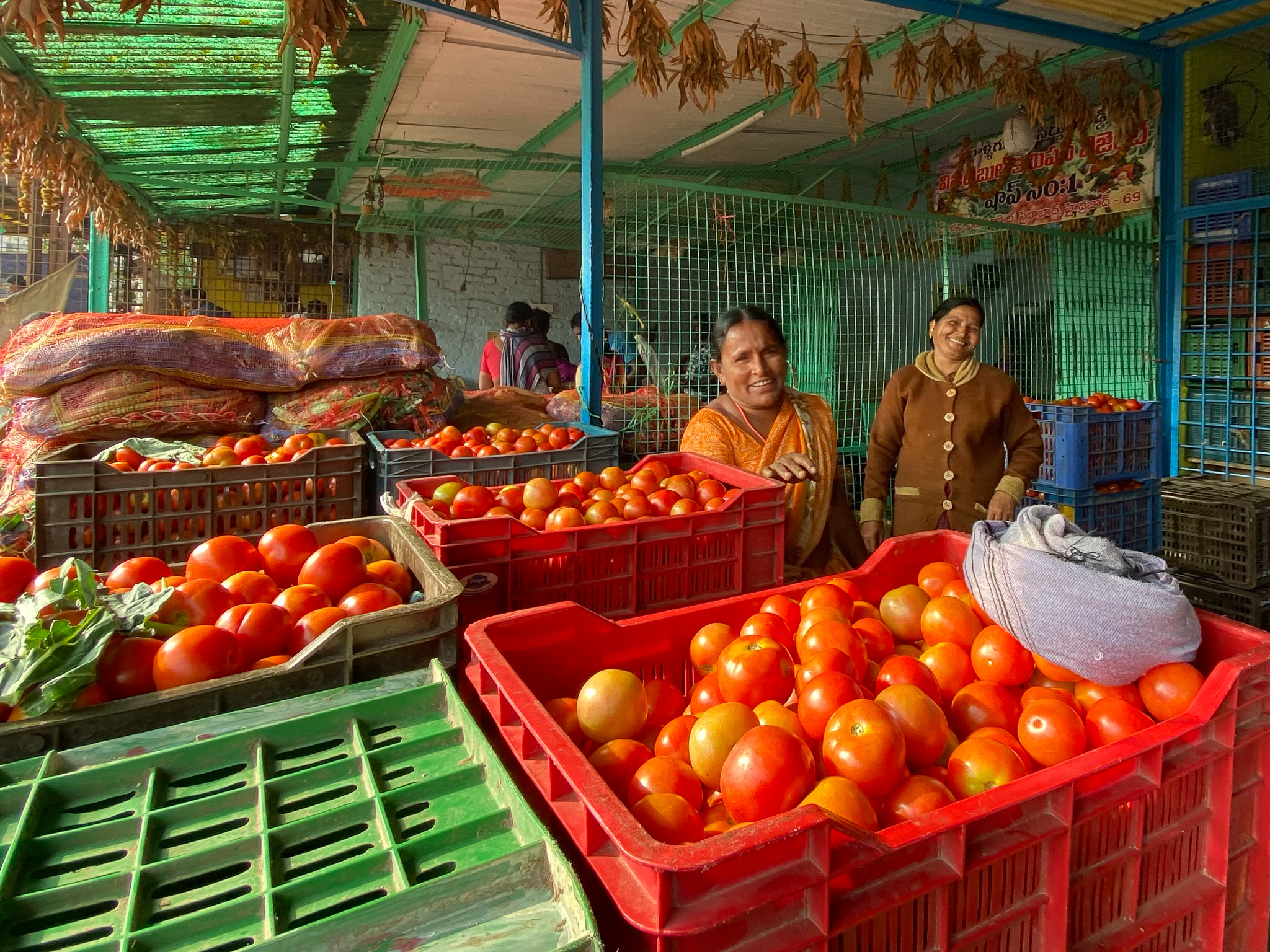 Two women selling tomatoes
