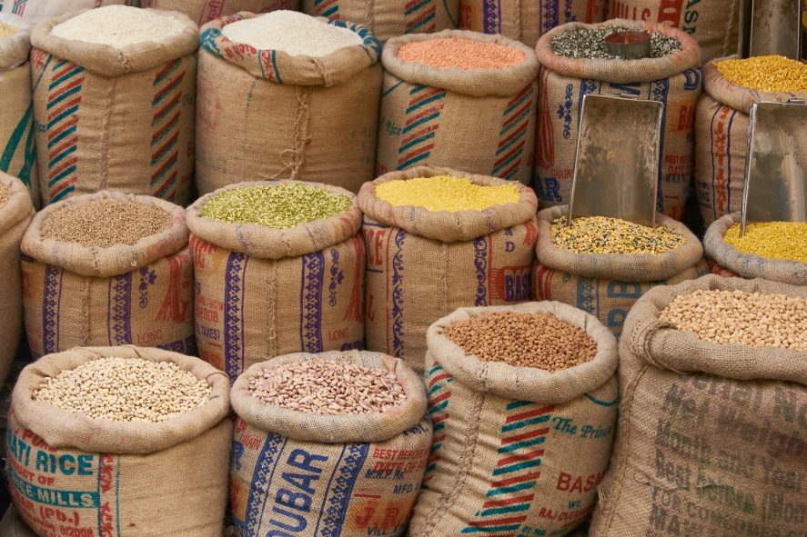 Colorful arrangement of pulses and lentils for sale at a market